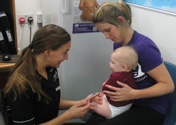 MRF Communications Officer Amy Luker and her son Jacob getting his MenB vaccine