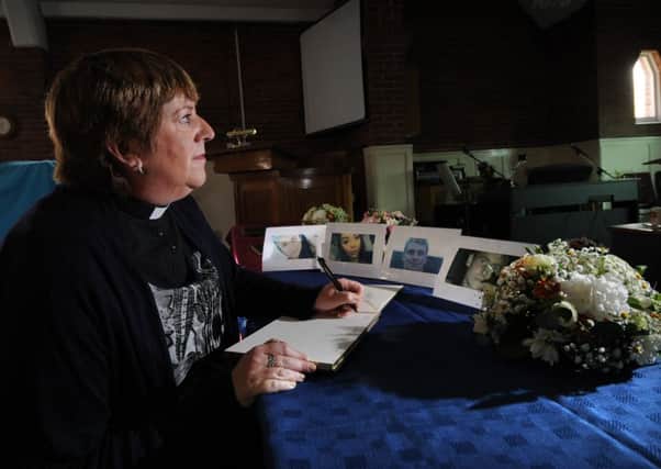 Rev Jacquie Evans the vicar at Upton Methodist Church, signs the book of Condolence, for the victims of the Quad Bike accident...SH10014315b...29th September 2015 Picture by Simon Hulme