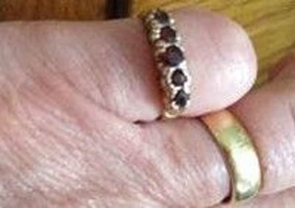 A ring very similar to the garnet ring stolen from 68-year-old Jean Callaghan in Outwood. It is 40 years old and belonged to her grandma.
