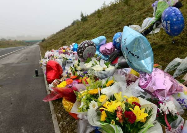 1 oct 2015...flowers at the scene of a RTA near Hemsworth where four people died when a quad bike collided with a sports car. Picture Scott Merrylees SM1009/67c