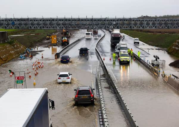 Traffic crawls through flood water both ways on the A1 between the two A6136 Catterick junctions following heavy rain overnight. Highways are working to pump the water away and alleviate the traffic. October 7 2015.