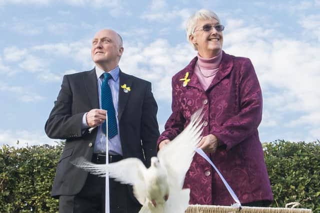 Picture by Allan McKenzie/YWNG - 09/10/2015 - Press - Elsie Frost Memorial Tribute - St George's Church, Lupset, Wakefield, England - Elsie Frost's brother & sister, Colin Frost & Anne Cleave, release the doves in memory of Elsie.