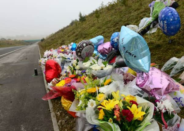 1 oct 2015...flowers at the scene of a RTA near Hemsworth where four people died when a quad bike collided with a sports car. Picture Scott Merrylees SM1009/67c
