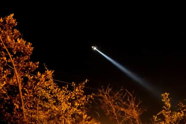 Police helicopter at the scene of the rescue. Photograph by Ash Milnes