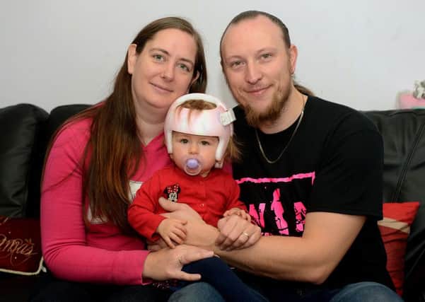 Newspaper: Wakefield Express.
Story: Sedgwick family from Overton. Hoping to raise £1,950 for treatment for 16 month old daughter, Amy, who has plagiocephaly - 'flat head syndrome'. The family have been told by the NHS that they will not fund the treatment, as it is deemed cosmetic.
photo date: 05/11/15
Picture Ref: AB516a1115