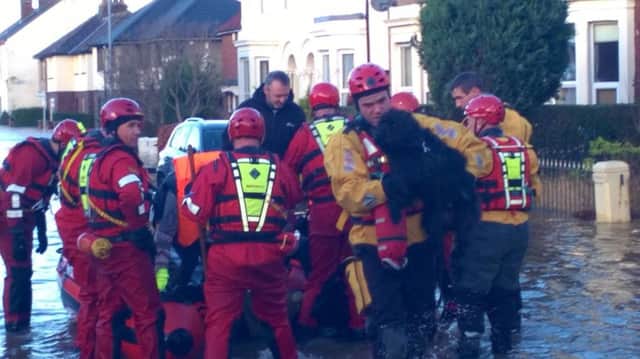West Yorkshire firefighters assist with flood relief effort in Cumbria. Photograph: West Yorkshire Fire and Rescue Service