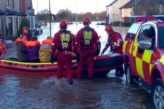 West Yorkshire firefighters assist with flood relief effort in Cumbria. Photograph: West Yorkshire Fire and Rescue Service