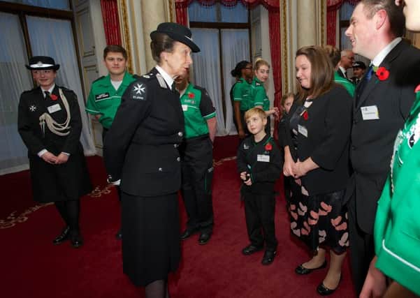 Princess Anne meeting St John Ambulance young achiever John Brooks and parents Lindsay and Andrew Brooks.