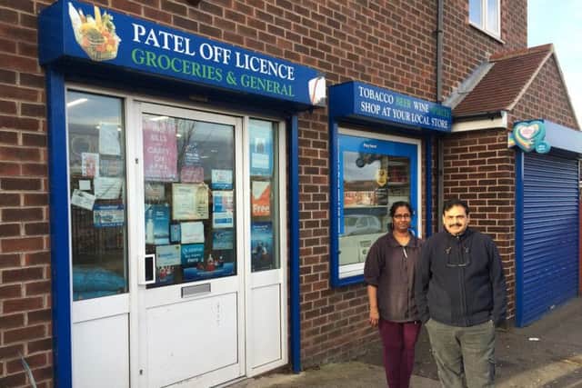 Hemlata and Mahesh Patel outside Patel Off Licence on George Street, Streethouse.
