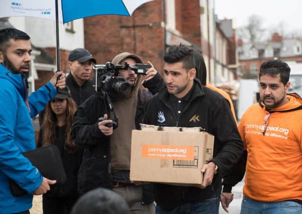 Amir Khan and the Penny Appeal  in Cumbria. Picture Irfan Bostan.