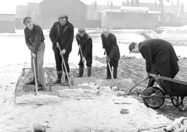 Snow in March 1979: The pitch at Wakefield Trinity rugby league club is cleared of snow.