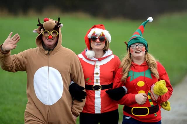 Newspaper: Wakefield Express.
Story: The annual santa dash run and bike ride held at Pugney's water park, Wakefield, in aid of Wakefield Hospice.
Photo date: 13/12/15
Picture Ref: AB566b1215