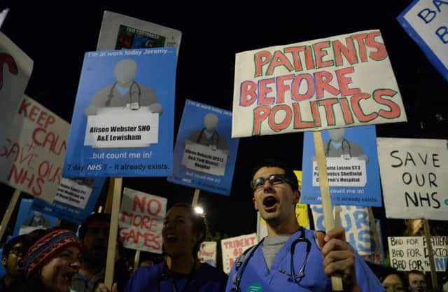 Junior doctors and medical students protest against the proposed changes to their contracts during a rally in Victoria Gardens, Leeds.Picture: Anna Gowthorpe