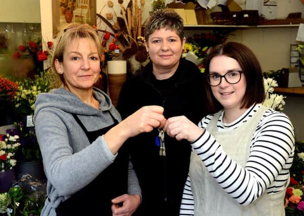 Newspaper: Wakefield Express.
Story: Caroline's Flower Shop (Horbury) owner, Caroline Lee, retires after 32 years in business.
Left to Right: Caroline Lee (retiring), Barbara Hirst - staff member and Faye Salisbury - new owner.
Photo date: 13/01/16
Picture Ref: AB012d0116
