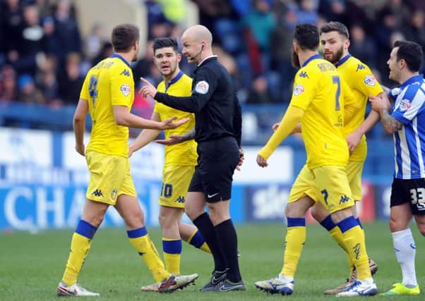 Referee Anthony Taylor is surrounded by Leeds players after the disallowed goal at Sheffield Wednesday. Picture: Simon Hulme