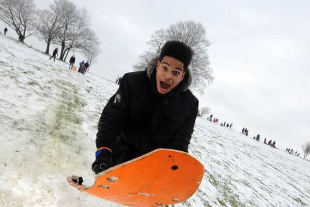 Children enjoy the snow at Roundhay Park. Luckas Sableman-Blue takes to the air on the slopes. (Picture by Simon Hulme)