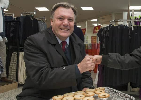 Picture by Allan McKenzie/YWNG - 131214 - Press - Ed Balls Mince Pie Give-Away - Asda Howley Park Road, Morley, England - Ed Balls hands out mince pies at the Asda in Morley, here with Jake Lawson..