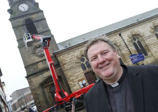 Father Bob Cooper, Vicar of Pontefract, outside St Giles Church where Lunch with Us runs on Wednesdays.