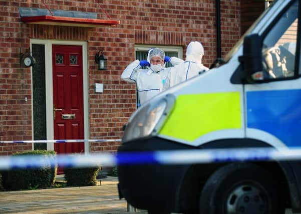 Polece forensic officers at the scene. PIC: Jonathan Gawthorpe