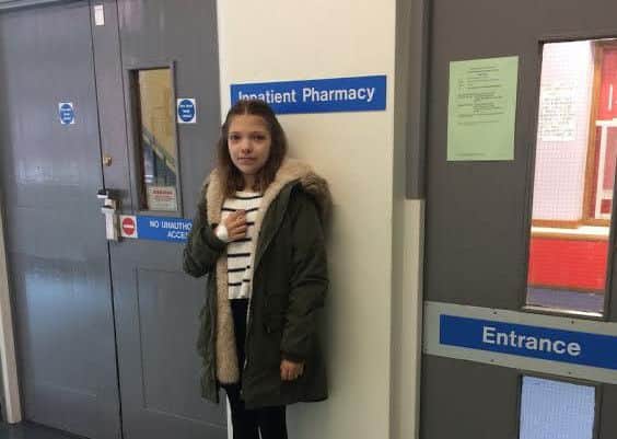 Abi Longfellow outside the room where the drugs she needs is kept.