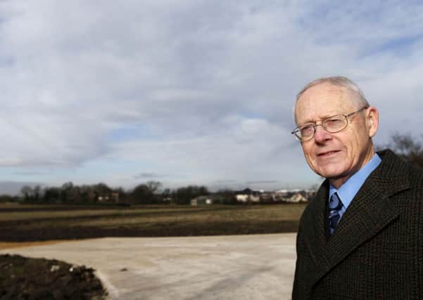 Plans to build a new retail park at Snowhill has been approved. It will create around 150 jobs and will include an Aldi and McDonald's. Pictured is ward councillor David Dews outside the site.