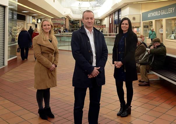 Newspaper: Wakefield Express.
Story: New owners of The Ridings shopping mall, Wakefield, NewRiver Retail.
L to R) Lucy Mitchell, Paul Wright, Sara Hassan.
Reporter: Michael Muncaster.
Photographer: Andrew Bellis.
Photo date: 10/02/16
Picture Ref: AB053b0216