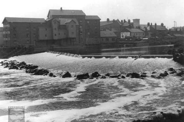 The River Aire, the weir and Allinson's Flour Mill, Castleford, 1950s