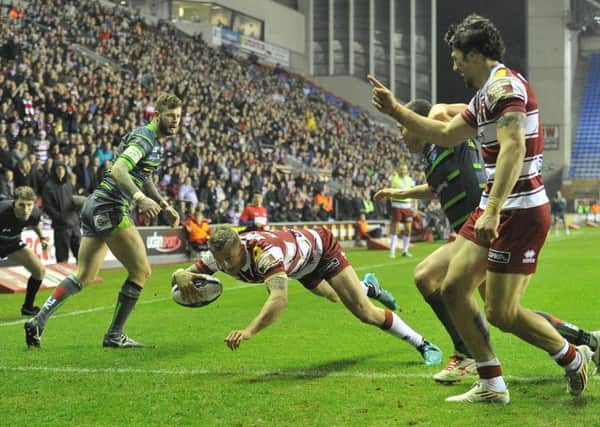 Wigan Warriors' Dominic Manfredi scores his sides 3rd try 

First Utility Super League match at the DW Stadium Stadium, Wigan. Picture by Dave Howarth for BERNARD PLATT. Picture date: Friday March 11, 2016