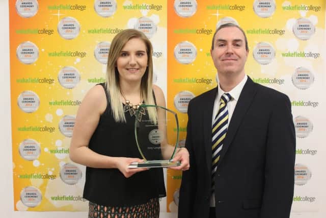Amy Longfellow, who won the Level 2 apprentice of the year at a Wakefield College ceremony, with Adrian Rooney, from sponsors Bardsley .