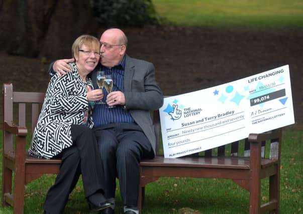 Susan and Terry Bradley celebrating scooping Â£99,074 after matching five numbers and the bonus ball in Saturdays National Lottery draw.