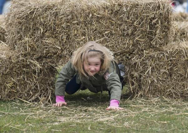 Picture by Allan McKenzie/YWNG - 19/03/16 - Press - World Downs Syndrome Day - Pontefract Park, Pontefract, England - Myla Johnson makes her way through the assault course at the Down Syndrome event at Pontefract Park.
