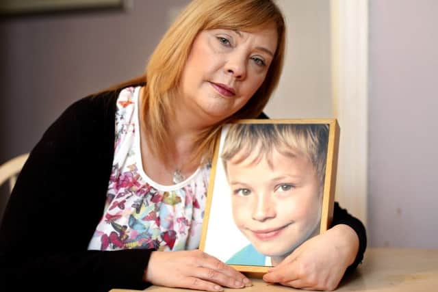 Pamela Whitlam with a picture of her son, Harry.
