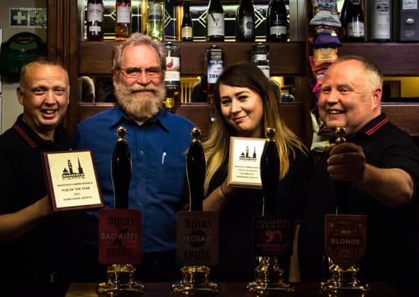 DOUBLE TOP: The Robin Hood at Altofts getting its awards from Wakefield CAMRA. Picture: Dan Todd.