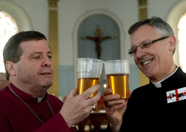 Newspaper: Wakefield Express.
Story: Festival to mark St George's day held at St Peter's church, Horbury.
Checking out the quality of the St George's ale that was being served up inside the church is Bishop Tony Robinson and Father Brian Bell.
Reporter: Gavin Murray.
Photographer: Andrew Bellis.
Photo date: 23/04/16
Picture Ref: AB171b0416