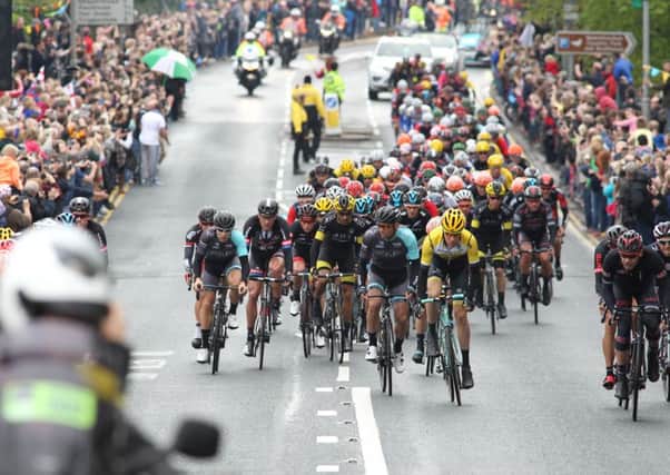 Tour de Yorkshire Stage 3. The riders climb out of Newmillerdam with massive crowd support.
