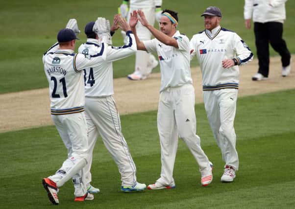 Yorkshire's Jack Brooks celebrates taking the wicket of Warwickshire's Ian Westwood.