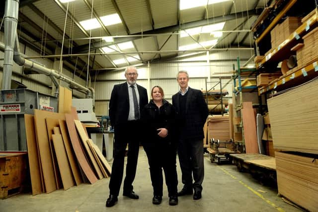 Featherstone based businesses Icon Office Design and Bram Racing are angry and bemused at BT's decision not to put in place high speed broadband for certain areas of Green Lane Industrial estate, Featherstone.
Pictured L to R) Local MP Jon Trickett, Michelle Hall - owner of Bram Racing and Jon Wesson - owner of of Icon Office Design.
p312a408