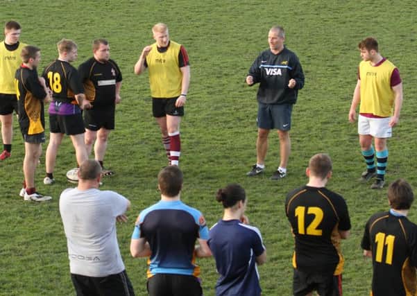 Stuart Lancaster on the pitch with Morley players as he took a training session at Scatcherd Lane.