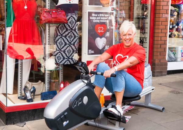BHF Area Manager Mechelle Hopkins takes on the rowing machine.