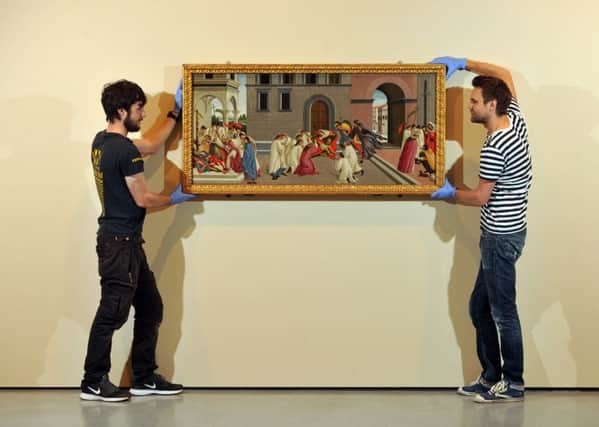 Workers hang Sandro Botticelli's Three Miracles of Saint Zenobius  as part of the Stanley Spencer: Of Angels and Dirt exhibition at the Hepworth Wakefield.  Picture Tony Johnson