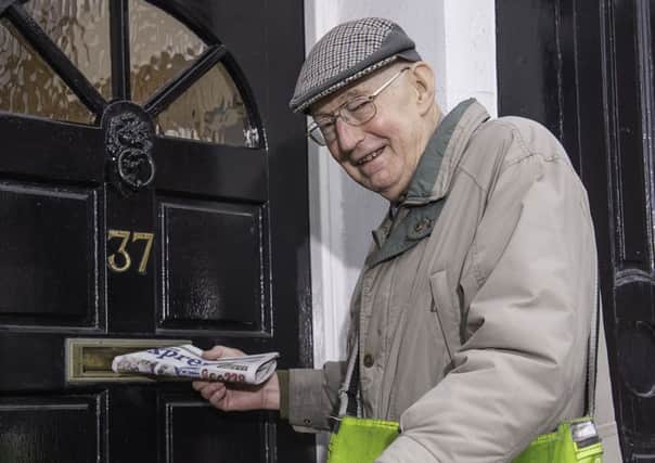 Colin Peaker delivering a copy of the Express on his paper round.