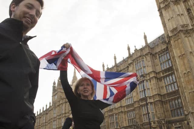 Leave supporters celebrate opposite the Houses of Parliament in London after voters in the referendum backed the campaign for the UK to leave the EU. Picture: Anthony Devlin/PA Wire
