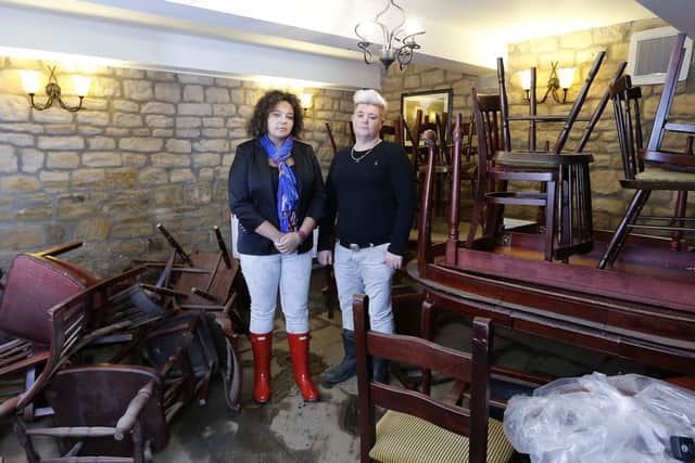 FLASHBACK: The Navigations landladies Sam Hall and Sharon Thompson survey the flooding damage back in January.