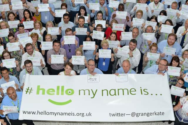 Asda staff in Leeds show their support for Dr Granger's #HelloMyNameIs campaign