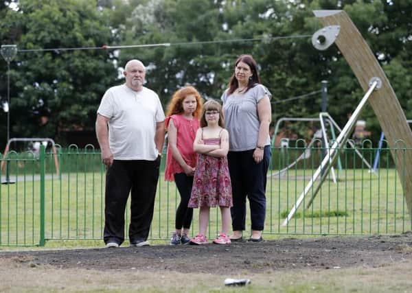 Ian Bain, Sarah, Grace and Lola Ainslie are shocked after equipment in Outwood Park was set on fire.