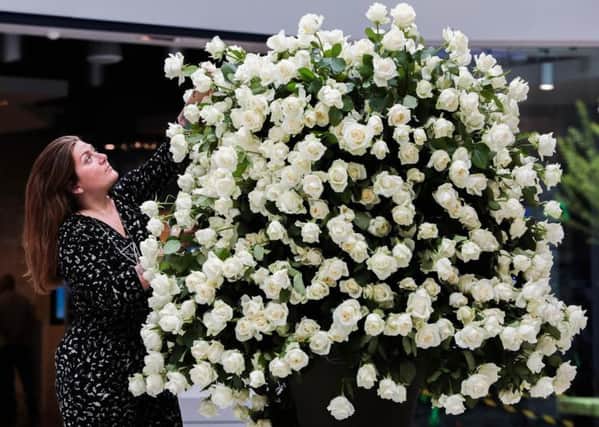 Lara Sanjar from Wild Renata Flowers with the UK's largest bouquet of white roses which she created to celebrate Yorkshire Day.