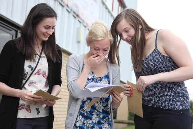 Girls react to receiving their A level grades.