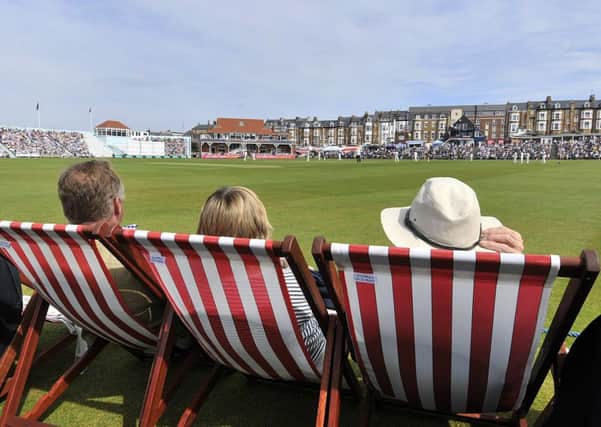 Spectators watch play from their deckchairs on the first day of Yorkshires match against Nottinghamshire at Scarborough (Picture: Richard Ponter).