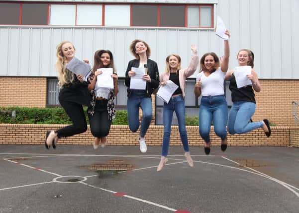 Students at Outwood Grange Academy jump for joy on GCSE results day.
