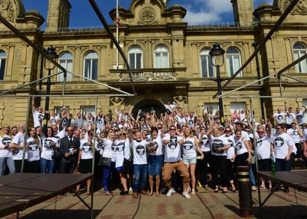 Hundreds gathered for the wake of Mick Riley at Ossett Town Hall. They have raised money for Diabetes UK by selling T shirts with a picture of Mick , who died from a diabetes related illness. Picture Scott Merrylees